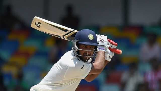 Pujara 256* flattens India Red