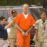 Handcuffed Stanford pleads not guilty
