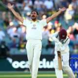 How many bowlers have dismissed a father and a son in Tests?
