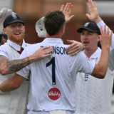 Robinson double-strike moves England closer between showers