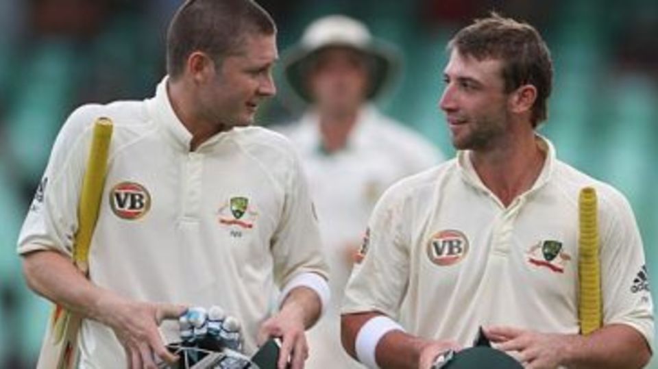 Michael Clarke and Phillip Hughes head back to the pavilion