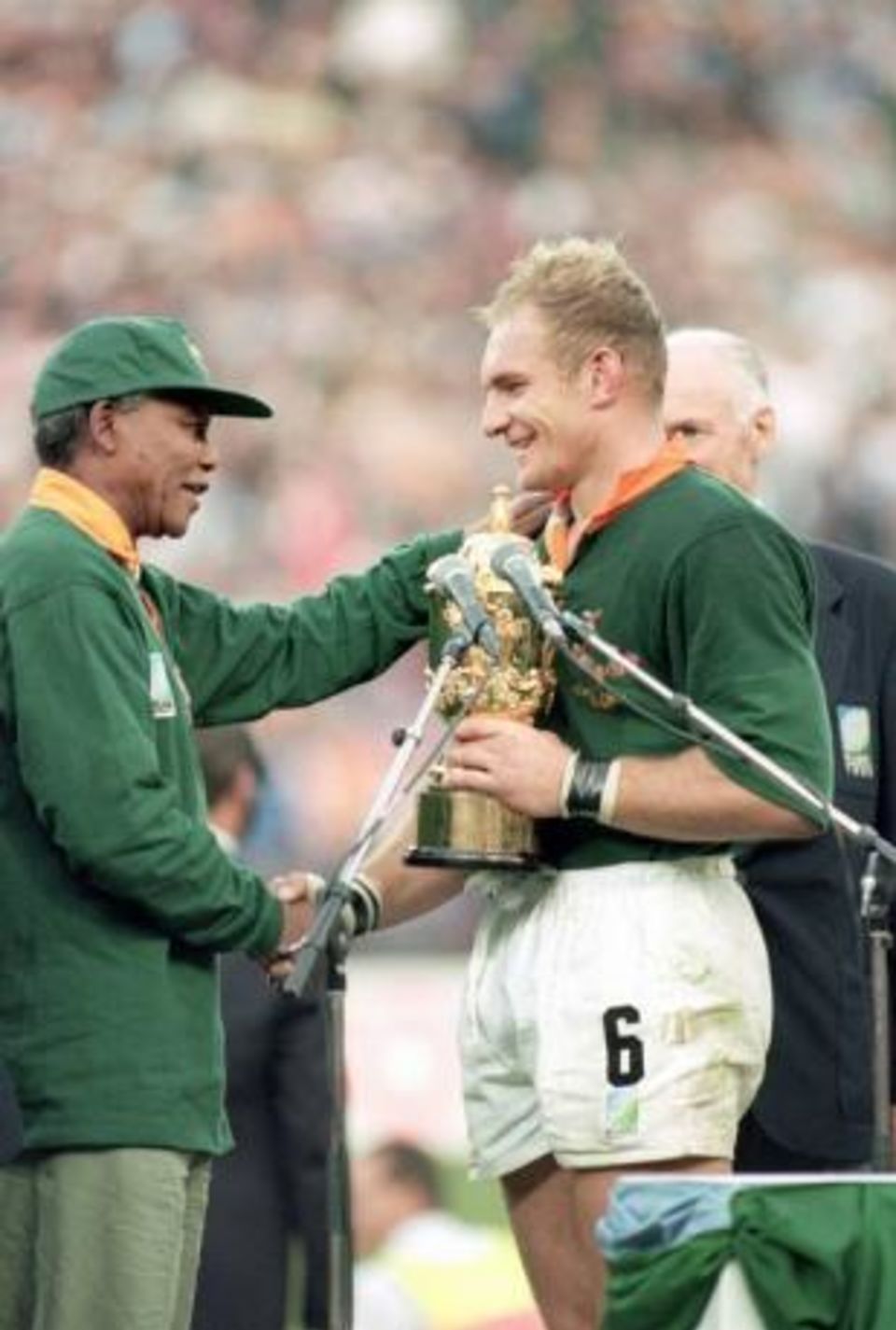 Pienaar's finest hour, receiving the rugby World Cup from Nelson Mandela in 1995