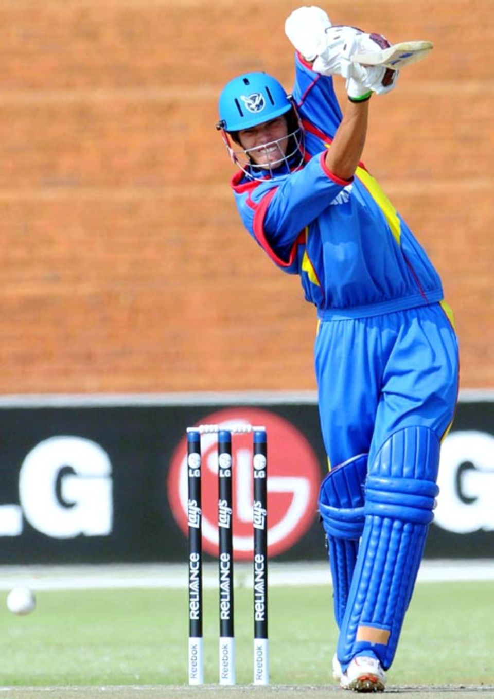 Namibia's Raymond van Schoor blasts the ball down the ground