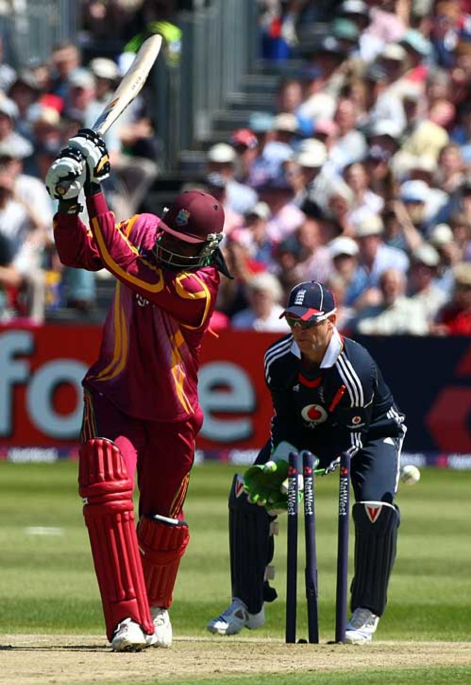 Chris Gayle is bowled by Graeme Swann after a brisk 31