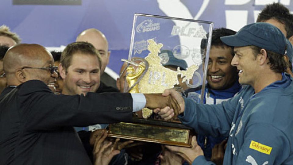 South African president Jacob Zuma hands the Deccan Chargers the IPL trophy