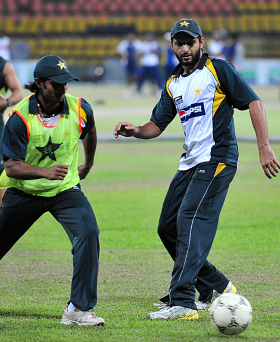 Imran Nazir and Shahid Afridi display their footballing skills
