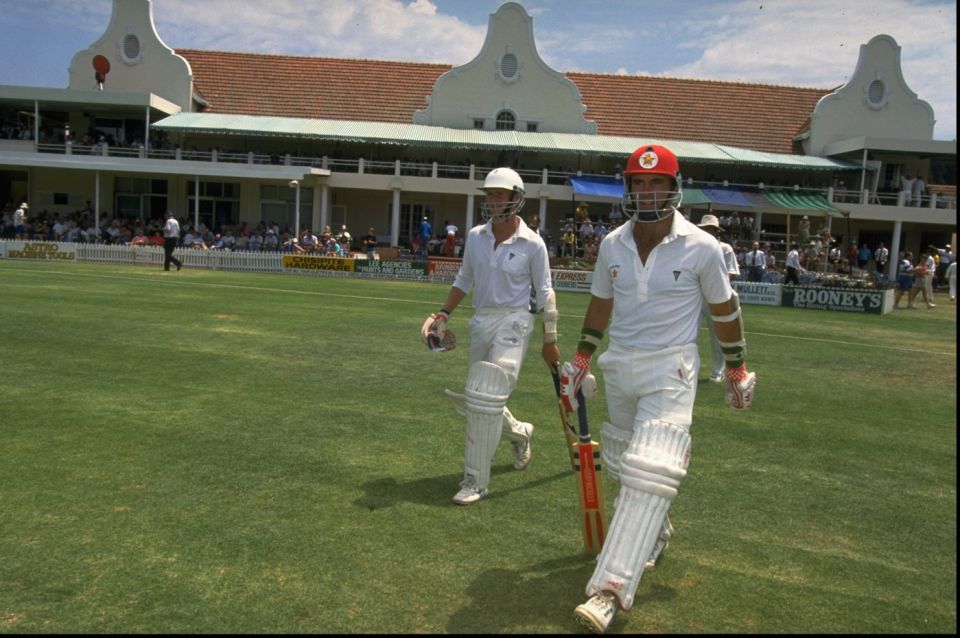Pioneers: Grant Flower (left) and Kevin Arnott walk out to bat in Zimbabwe's inaugural Test