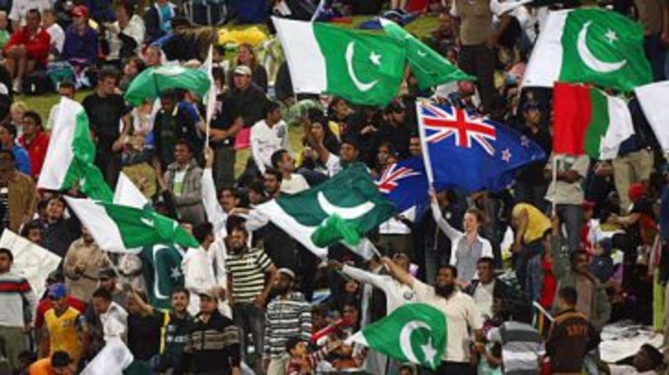 A New Zealand flag among the Pakistan ones