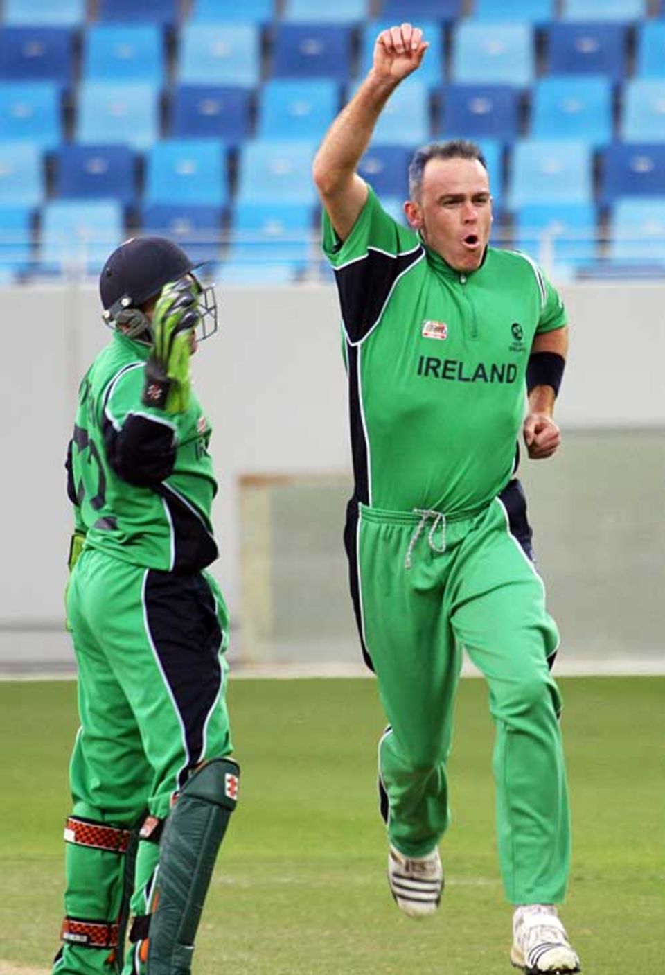 Trent Johnston celebrates one of his three vital wickets