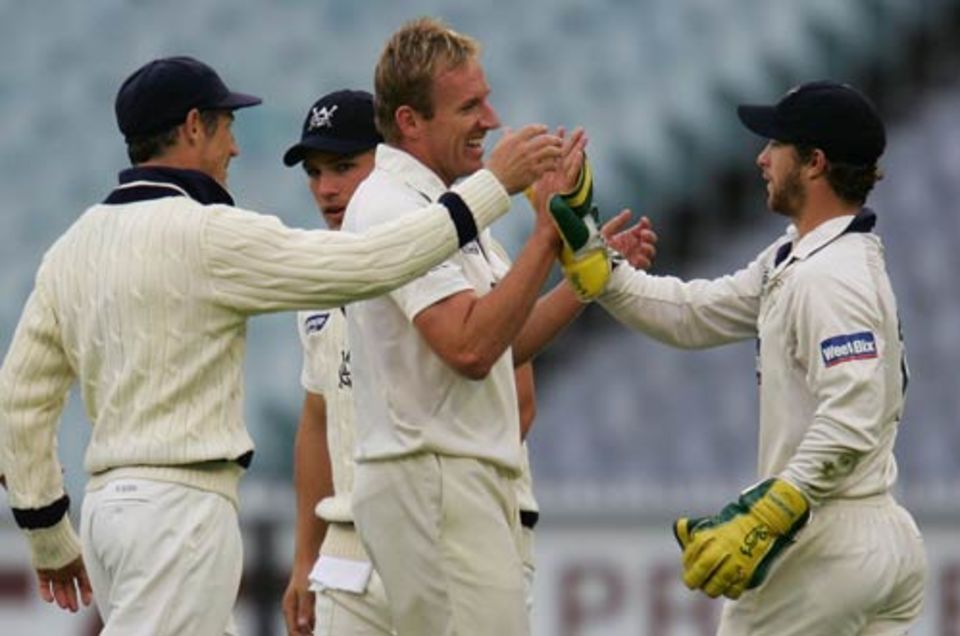 Damien Wright celebrates a wicket