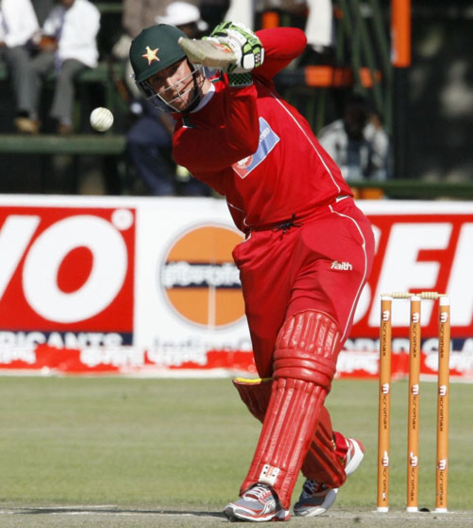 Brendan Taylor drives through mid on