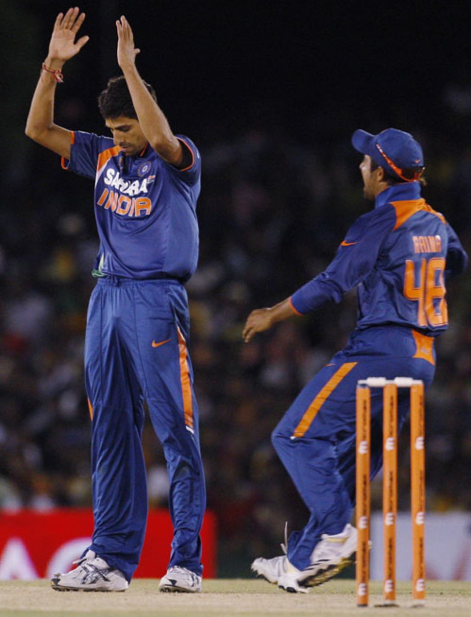 Ashish Nehra celebrates after sending Kumar Sangakkara back
