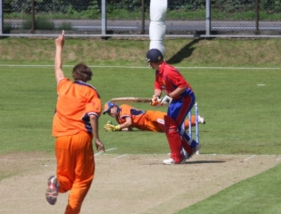 Corey Bisson is caught behind off the bowling of Dick van Baren
