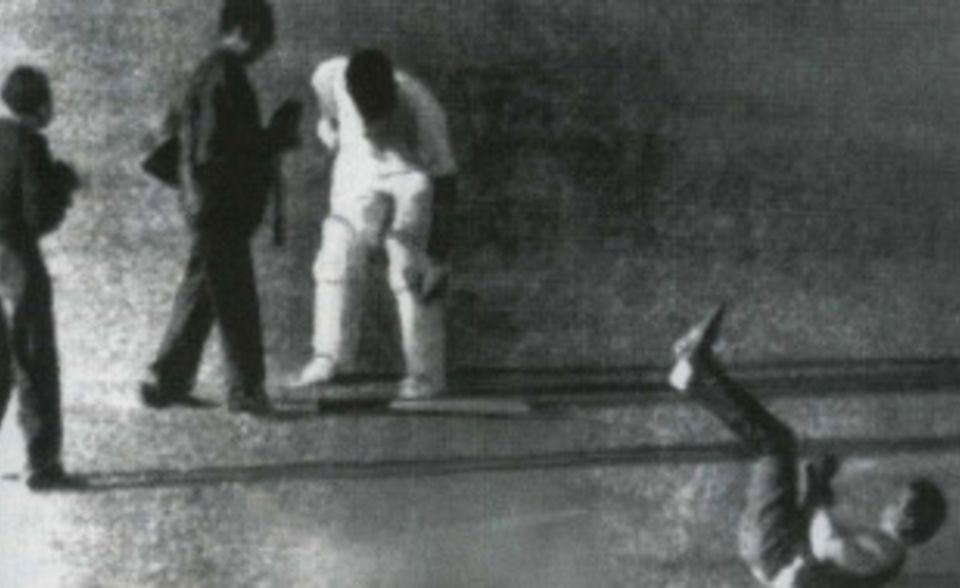 Bill Lawry was accused of striking a photographer with his bat during a pitch invasion in the Calcutta Test. This photo shows Lawry's bat as on the ground at the time, but he did admit to pushing the photographer