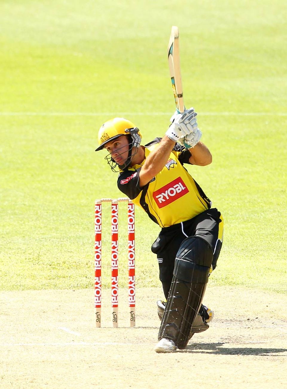 Liam Davis drives on the way to his century