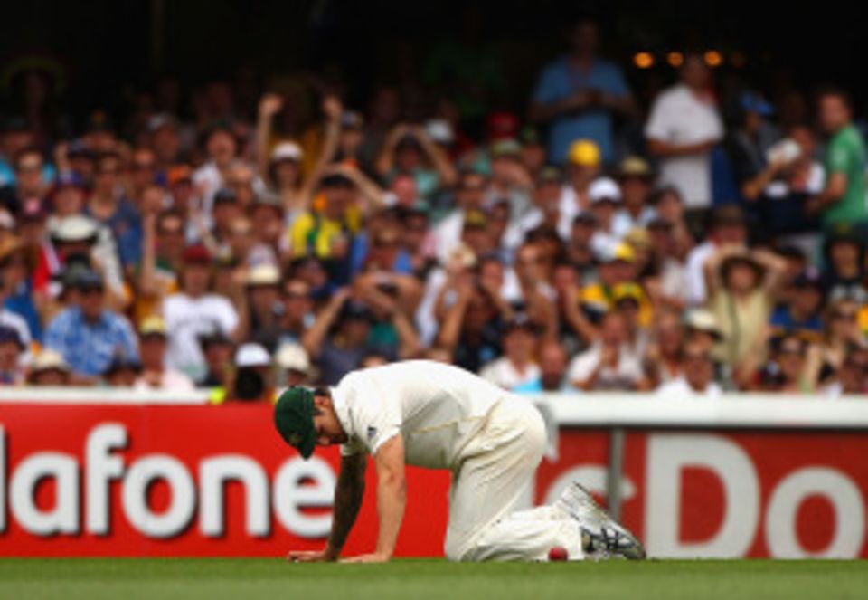 Mitchell Johnson rues his dropped chance during a trying day in the field