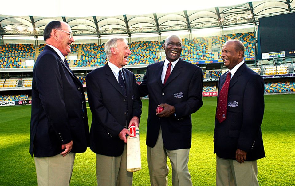 Meckiff (far left) with Lindsay Kline, Wes Hall and Joe Solomon - the four protagonists at the climax of the tied Test - during a reunion at the Gabba in 2000