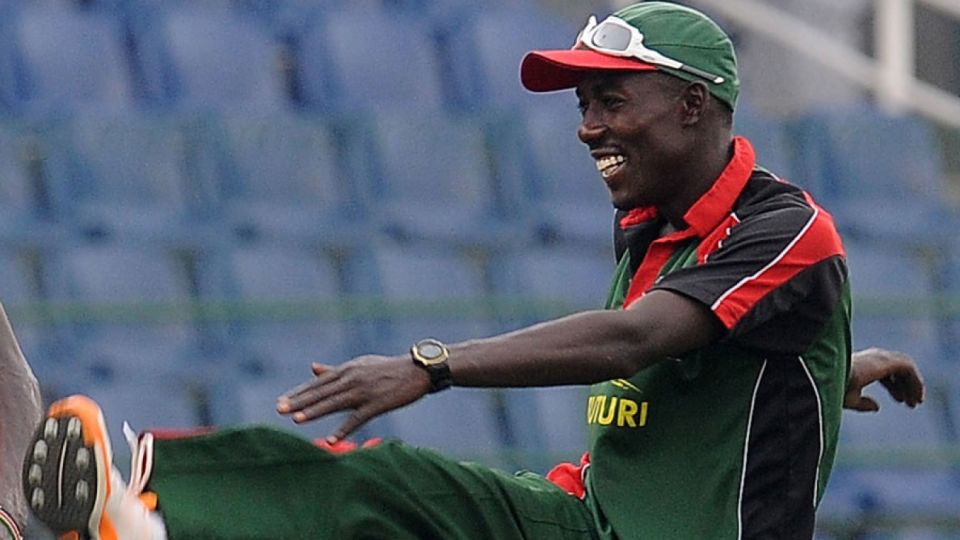 Jimmy Kamande warms up during Kenya's training session