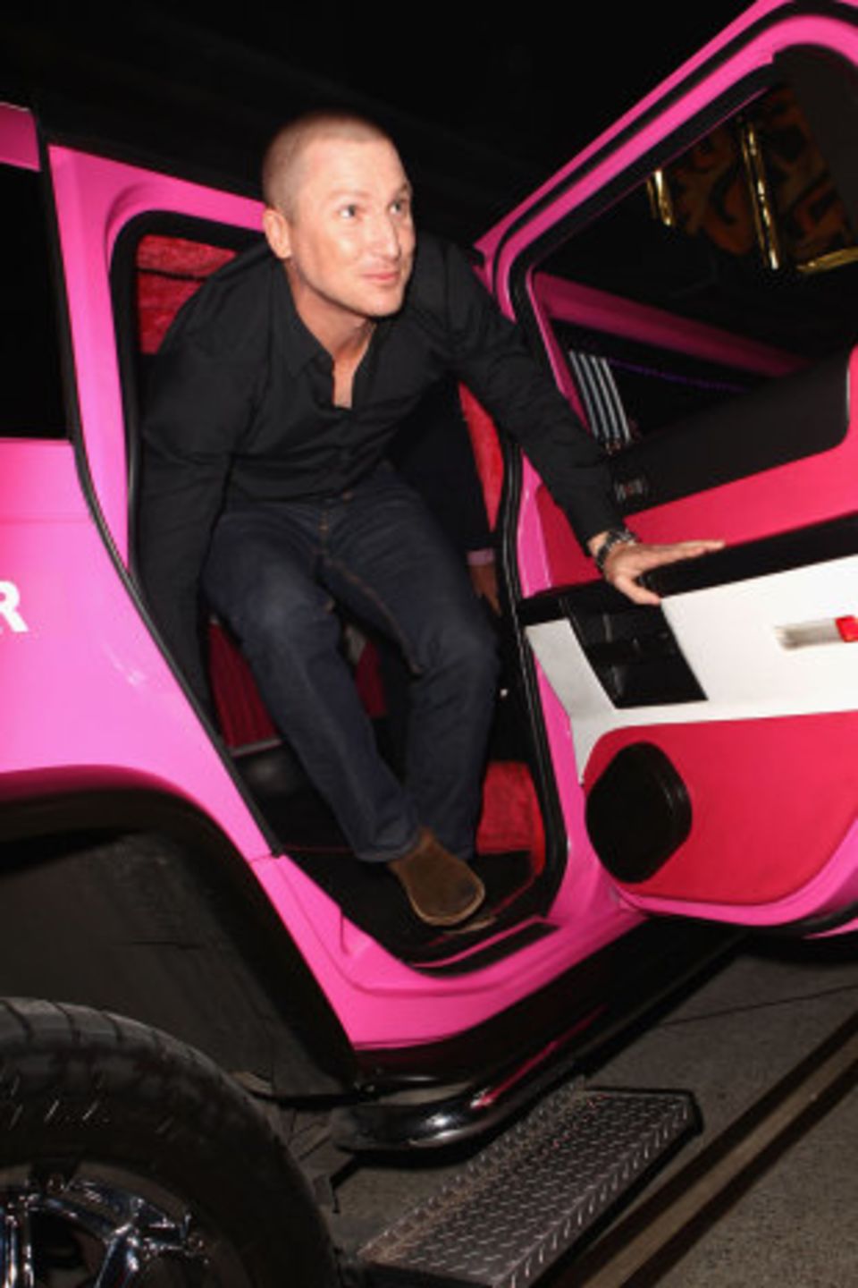 Brad Haddin emerges from a pink stretch Hummer at the launch party for the Big Bash League at Sydney's Carriageworks in July 2011, epitomising the showbiz feel of the tournament's beginning