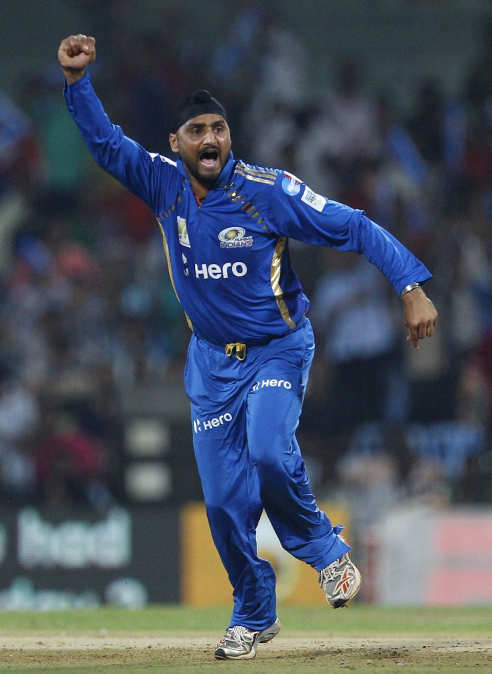 Harbhajan Singh celebrates the dismissal of Chris Gayle
