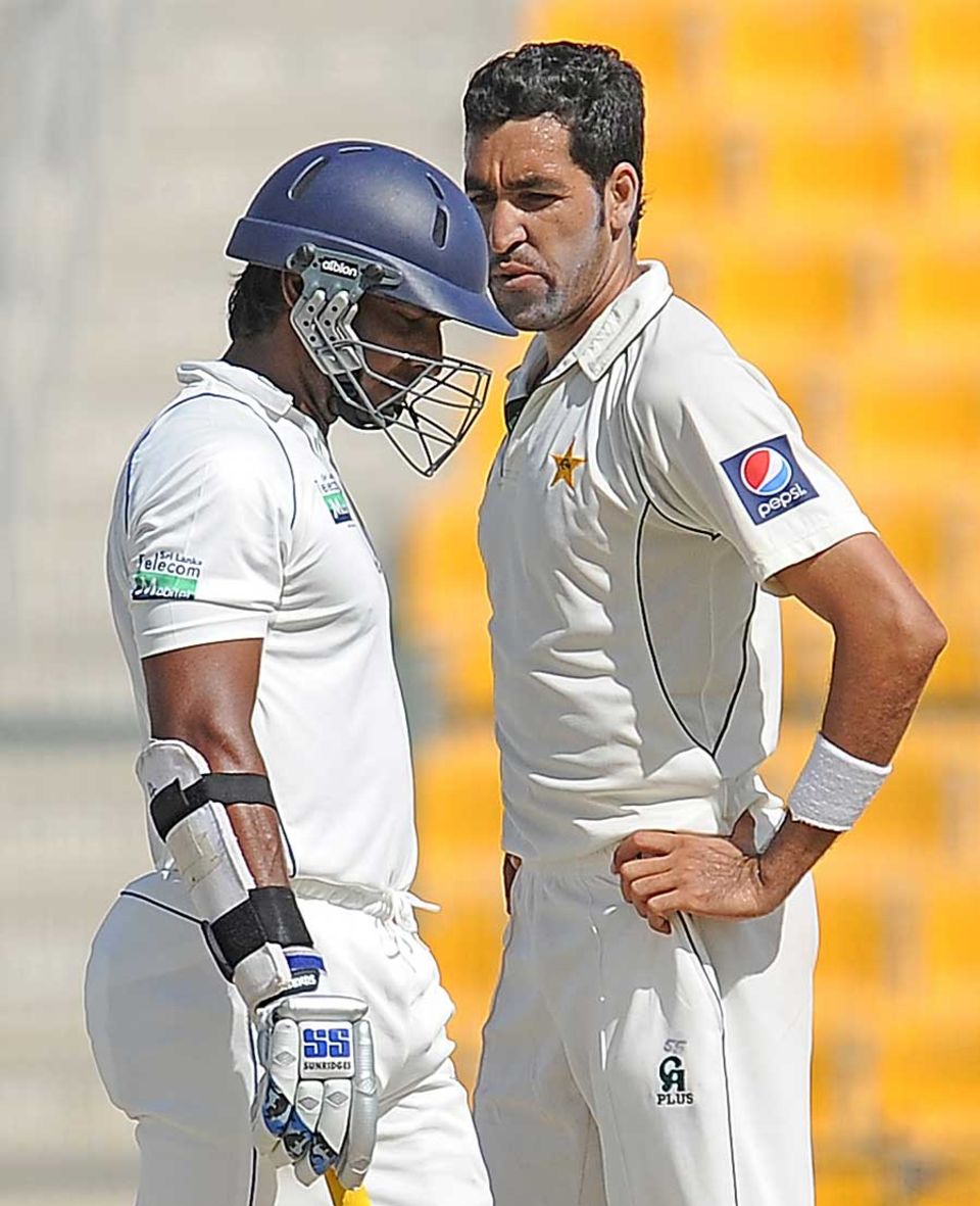 A frustrated Umar Gul can't help but stare at Kumar Sangakkara
