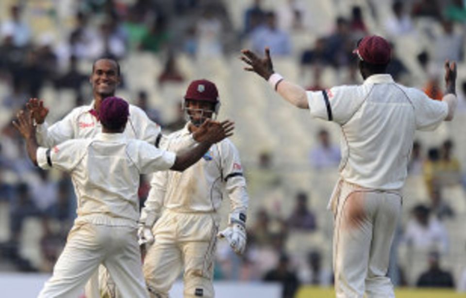 Kraigg Brathwaite bowled Rahul Dravid for his maiden Test wicket