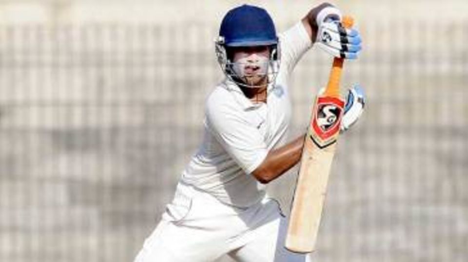 Robin Bist punches one during his century
