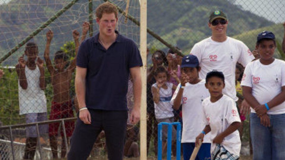 Prince Harry plays cricket with kids at a health centre in Rio De Janeiro