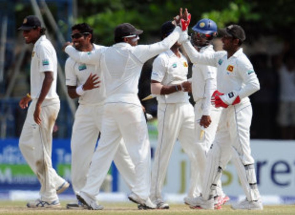 Sri Lanka captain Mahela Jayawardene celebrates with his players after the win over England