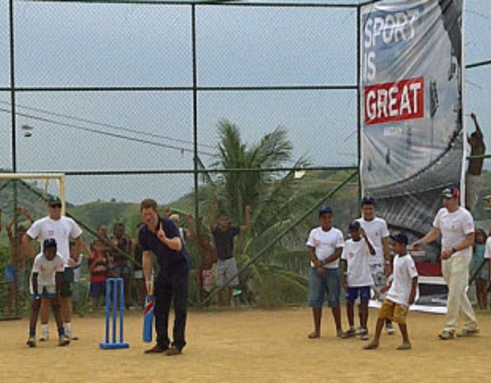 Prince Harry plays cricket with Brazilian kids