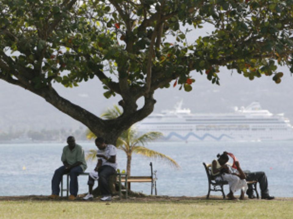 Locals and tourists by the sea at Montego Bay, Jamaica