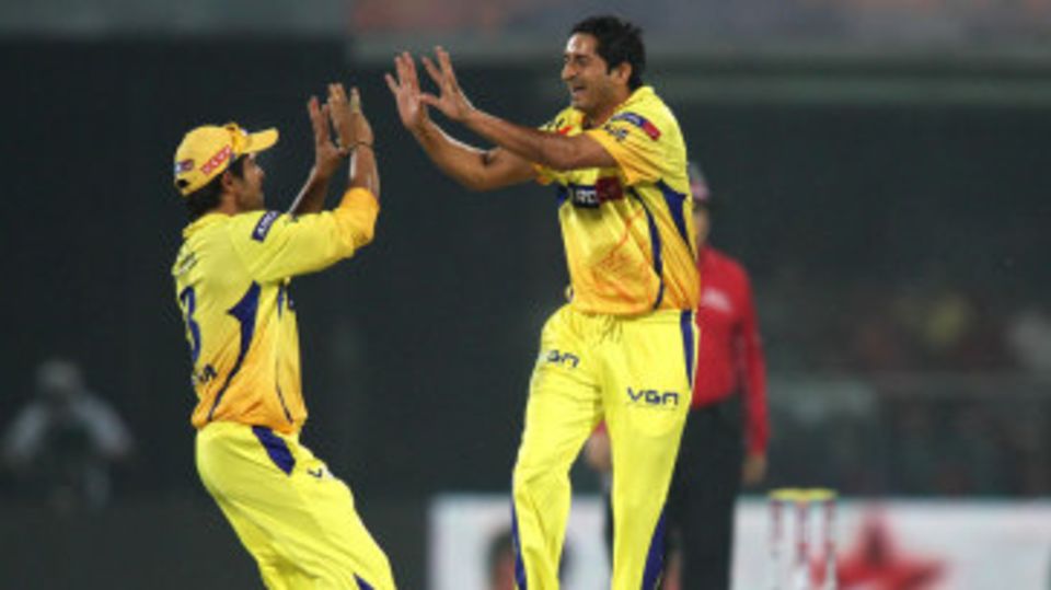 Suresh Raina and Mohit Sharma celebrate a wicket