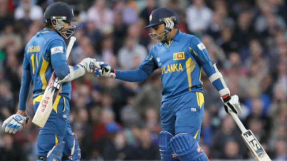 Kumar Sangakkara and Mahela Jayawardene punch gloves during their partnership