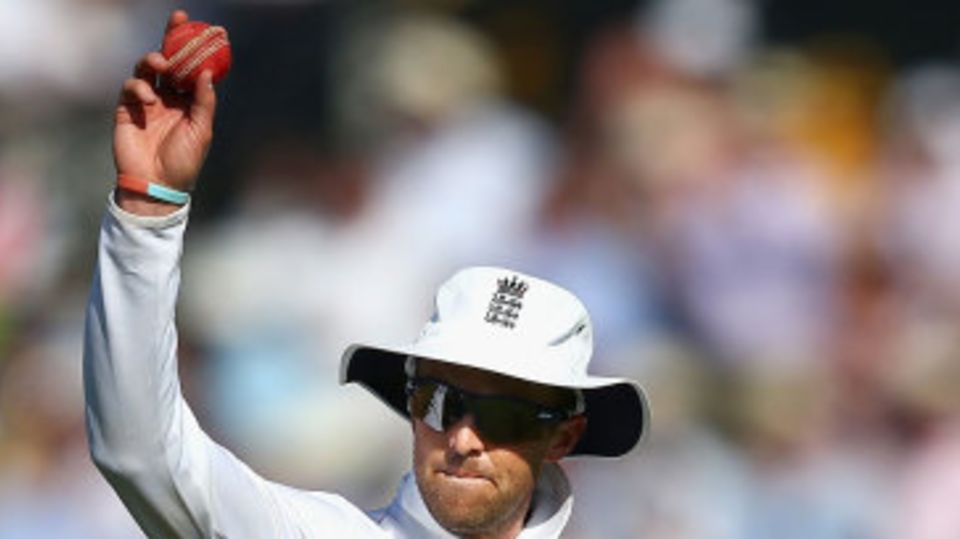 Graeme Swann raises the ball to the crowd after his five-wicket haul