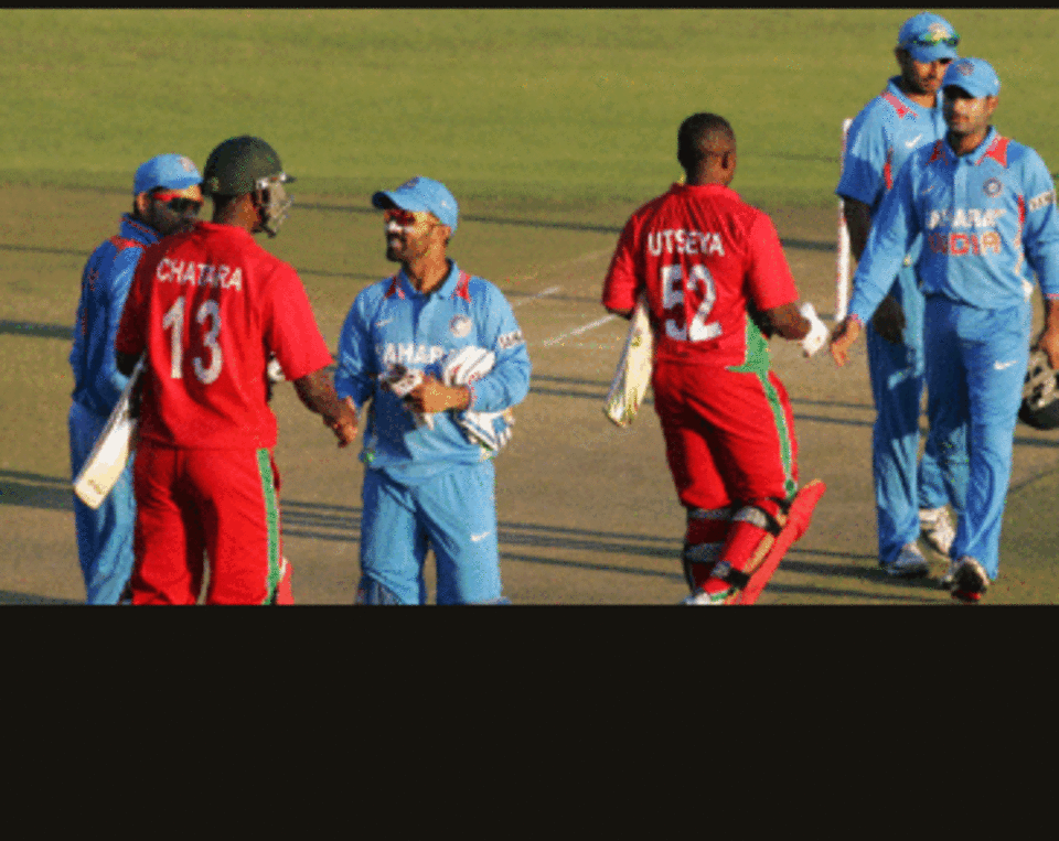 The Indian team is congratulated after their victory over Zimbabwe