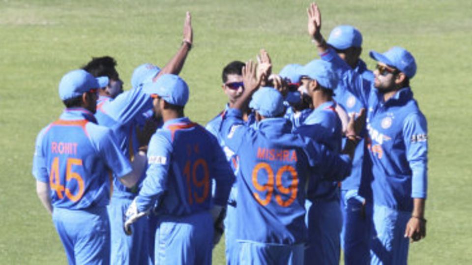 Indian players celebrate the wicket of Vusi Sibanda