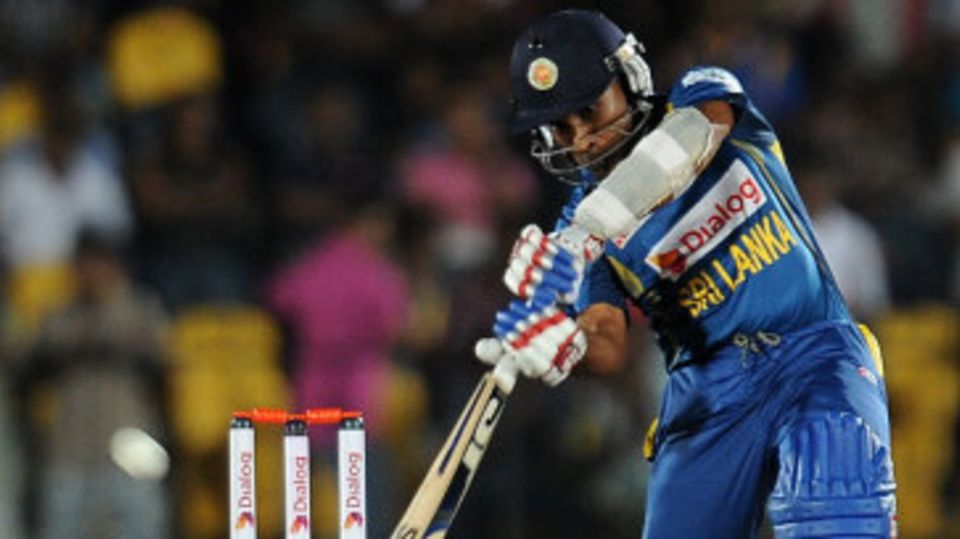 Mahela Jayawardene plays an inside-out shot over cover