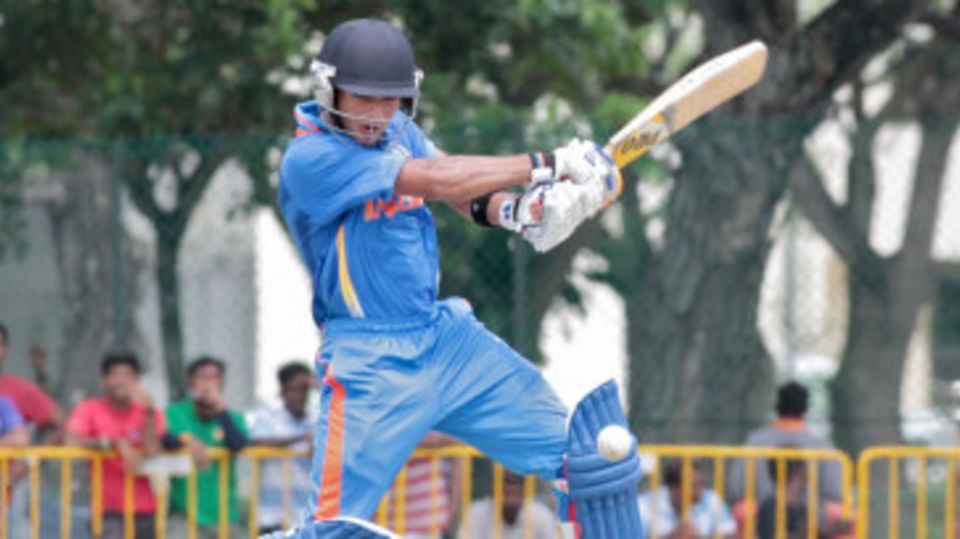 Unmukt Chand plays an attacking shot on the off side
