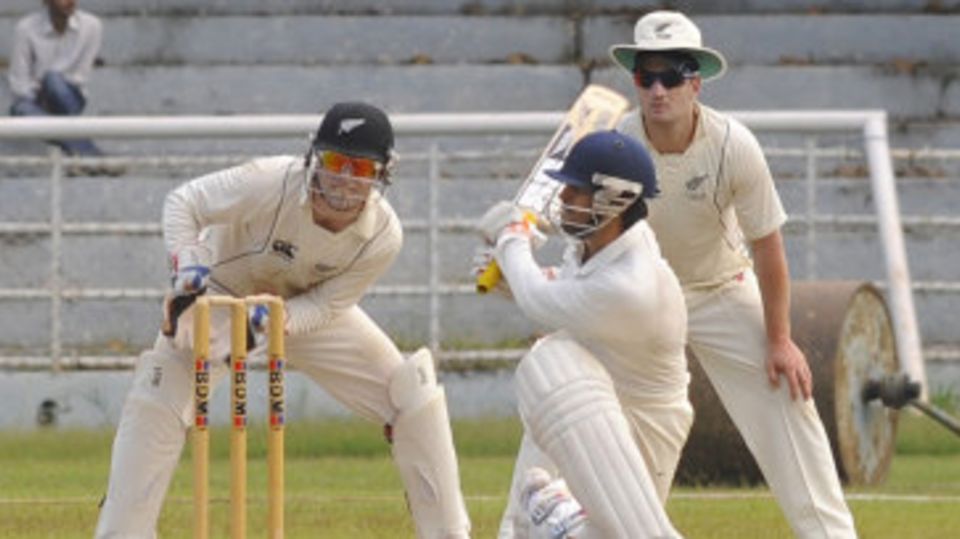 Abhishek Nayar sweeps the ball