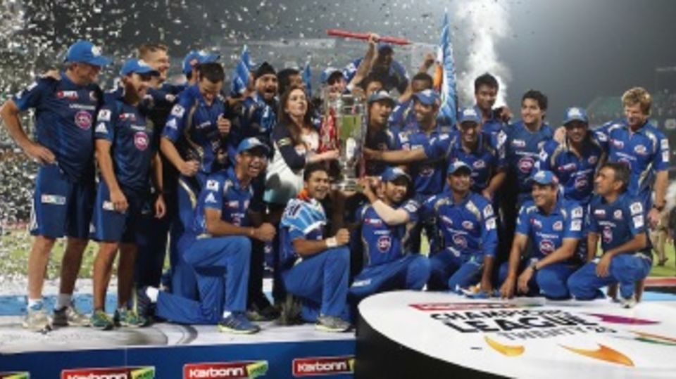 Mumbai Indians pose with the Champions League trophy