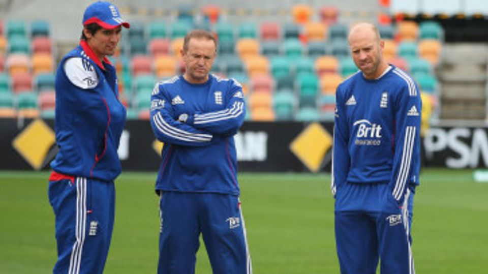 Alastair Cook, Andy Flower and Matt Prior inspect the damp, chilly scene