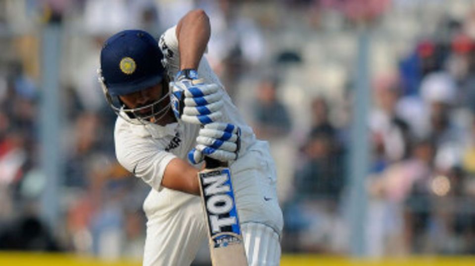 Rohit Sharma drives down the ground