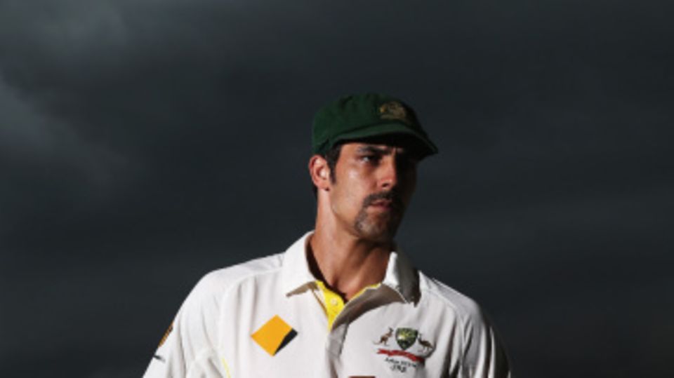 Mitchell Johnson poses under stormy Brisbane skies