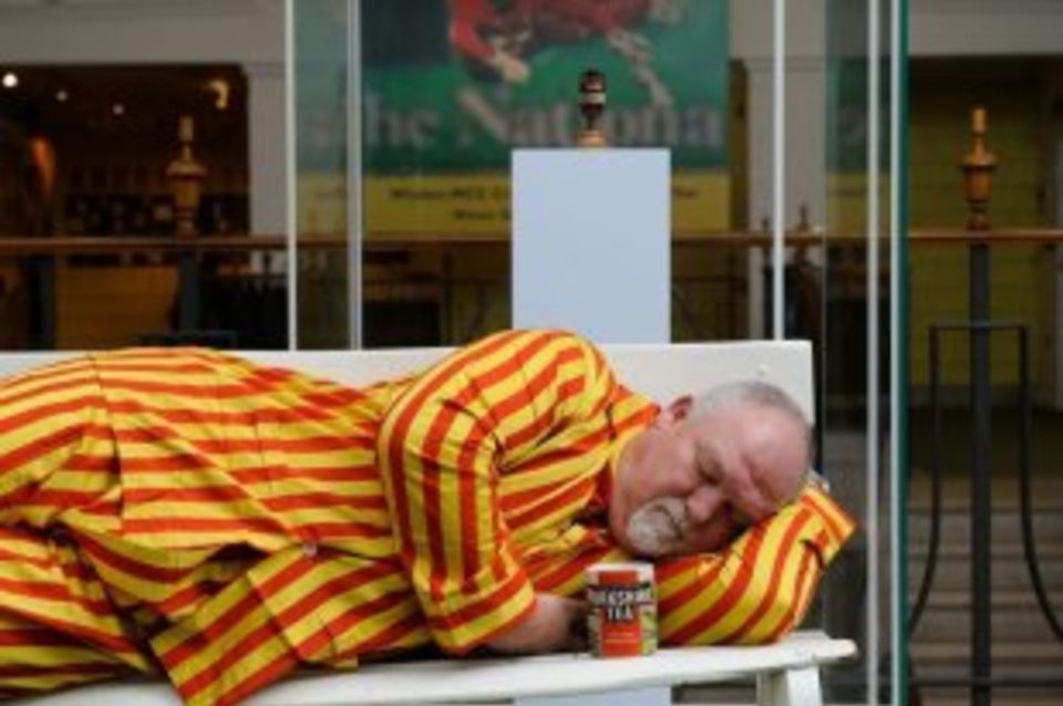 Mike Gatting rests on a Lord's bench, Ashes urn in the background, before his all-night Ashes session