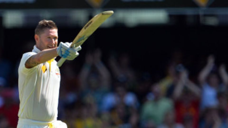 Michael Clarke salutes the dressing room after his hundred
