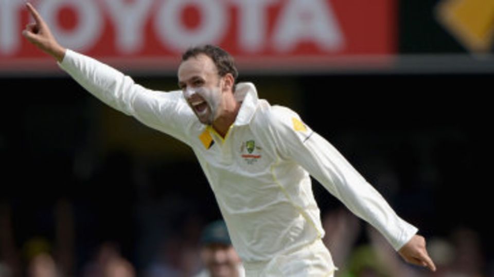 Nathan Lyon celebrates removing Alastair Cook