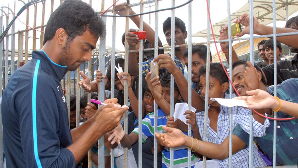 Jaydev Unadkat signs some autographs for fans