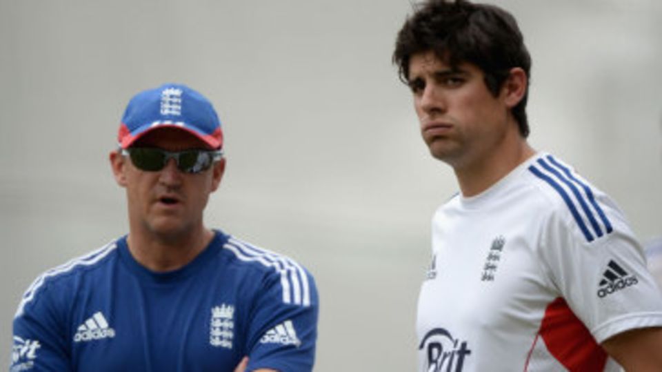Andy Flower and Alastair Cook look on
