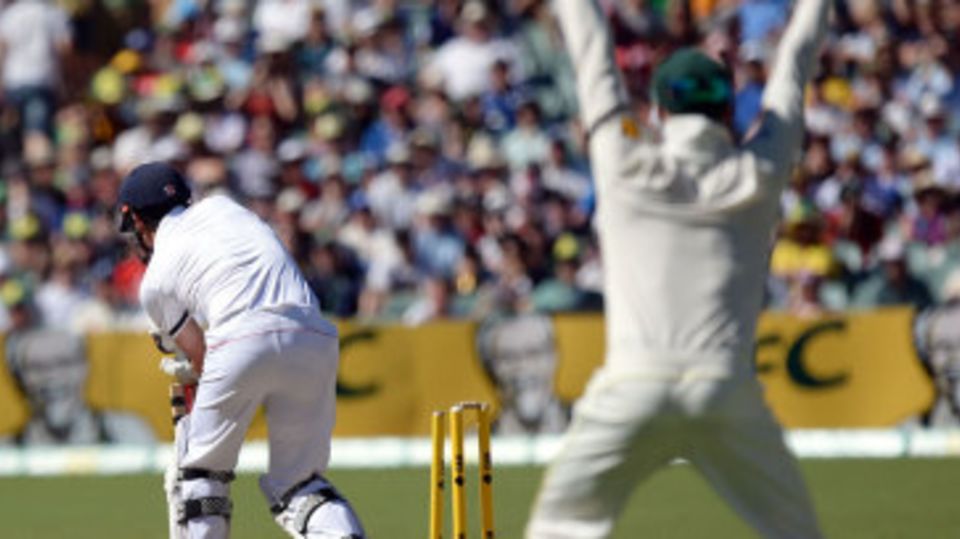 Michael Clarke celebrates the wicket of Alastair Cook from slip