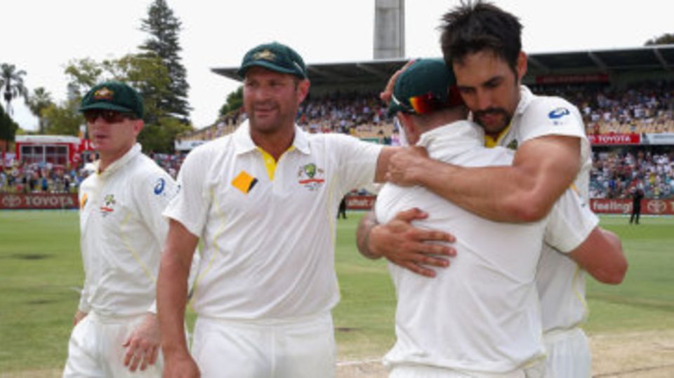 Mitchell Johnson gets a celebratory hug